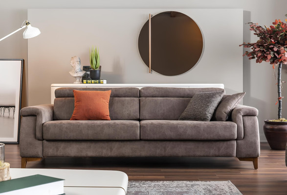 Kolme hengen harmaa kangassohva vuodemahdollisuudella