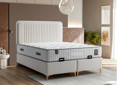 Tyylikäs sänky vaaleanbeigellä tekstiili- ja puupatjalla