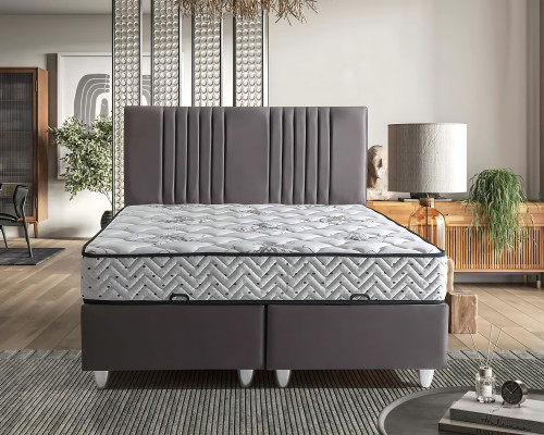 Harmaa tekstiilivuode modernilla patjalla