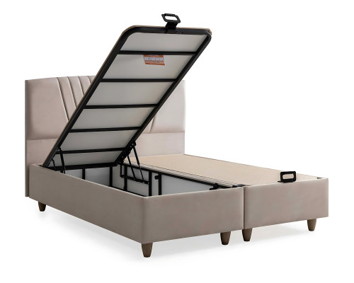 Tyylikäs sänky vaaleassa tekstiilissä ja puussa