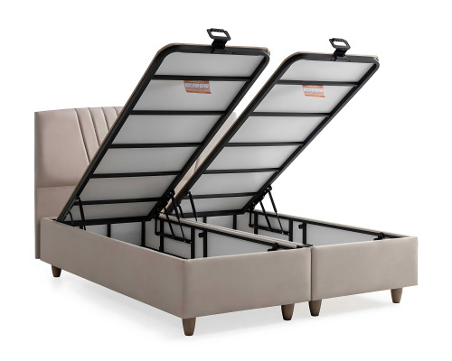 Tyylikäs sänky vaaleassa tekstiilissä ja puussa